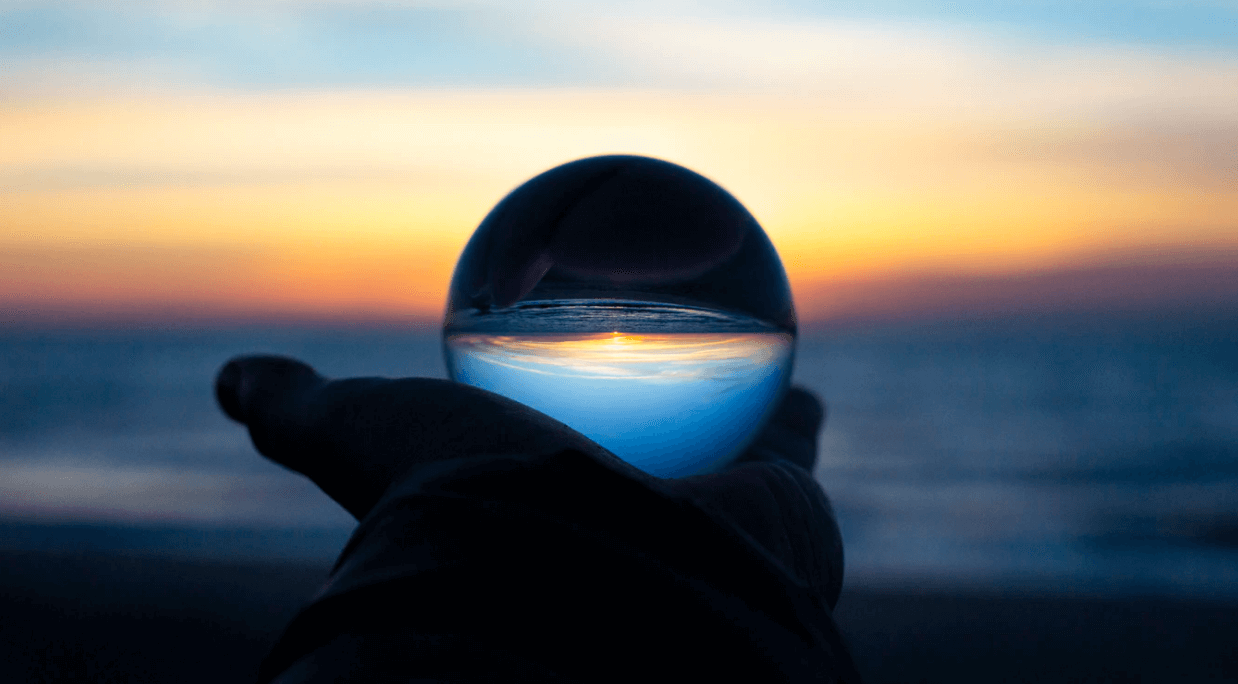 person holding a crystal ball