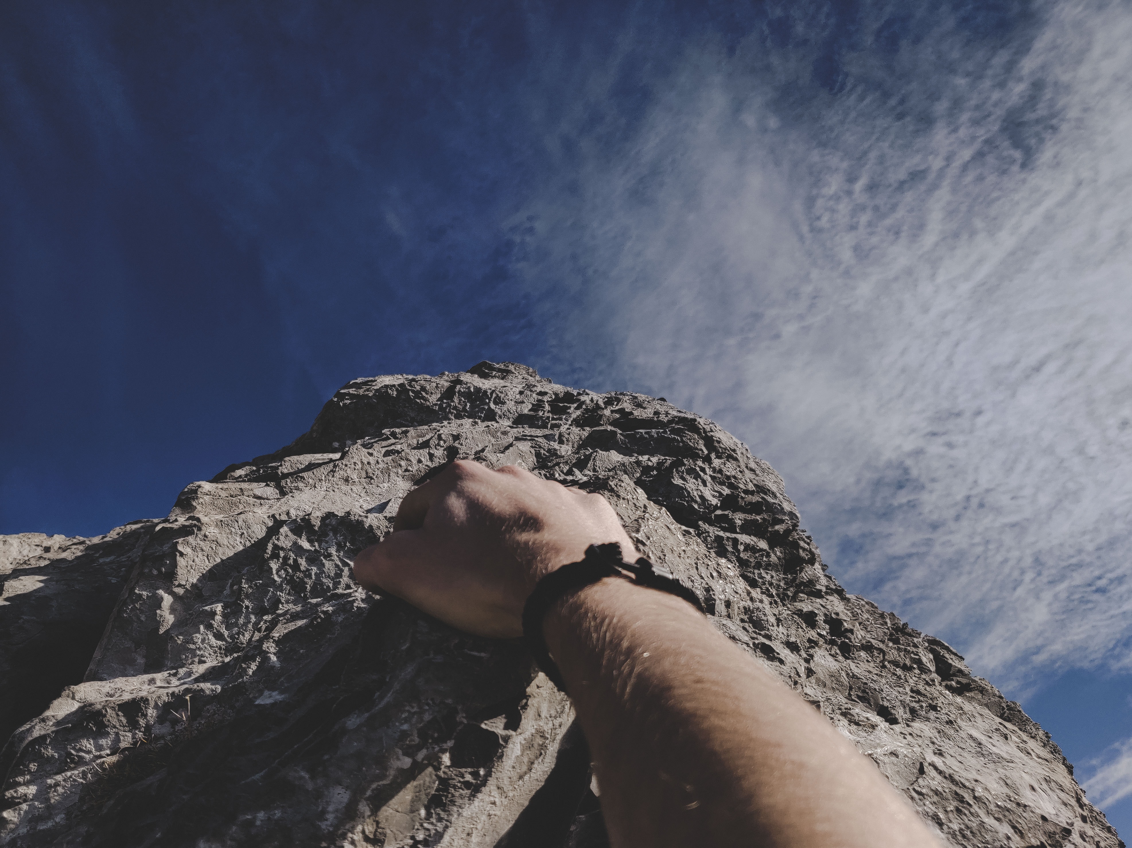 Picture of hand climbing up a mountain