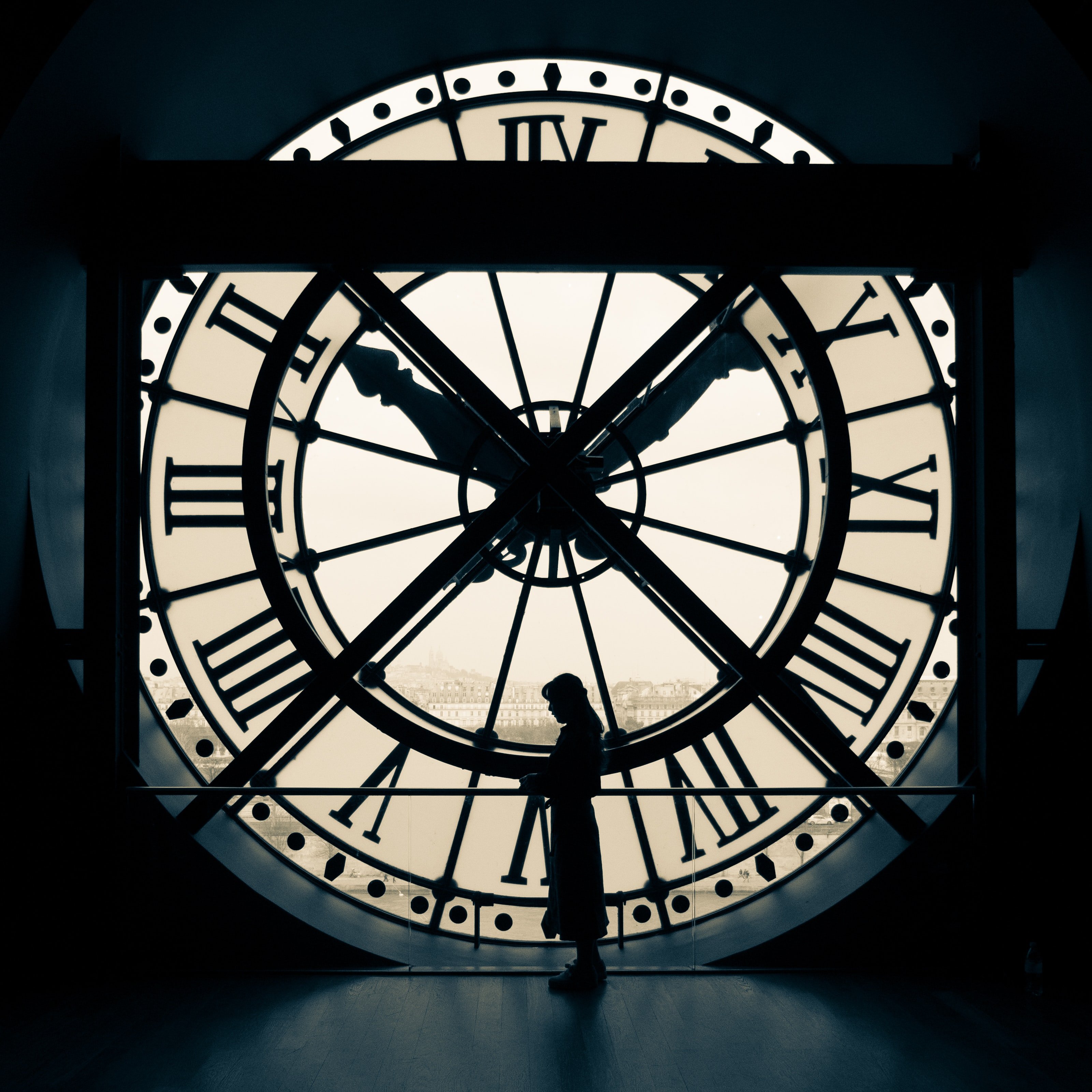 girl in front of clock