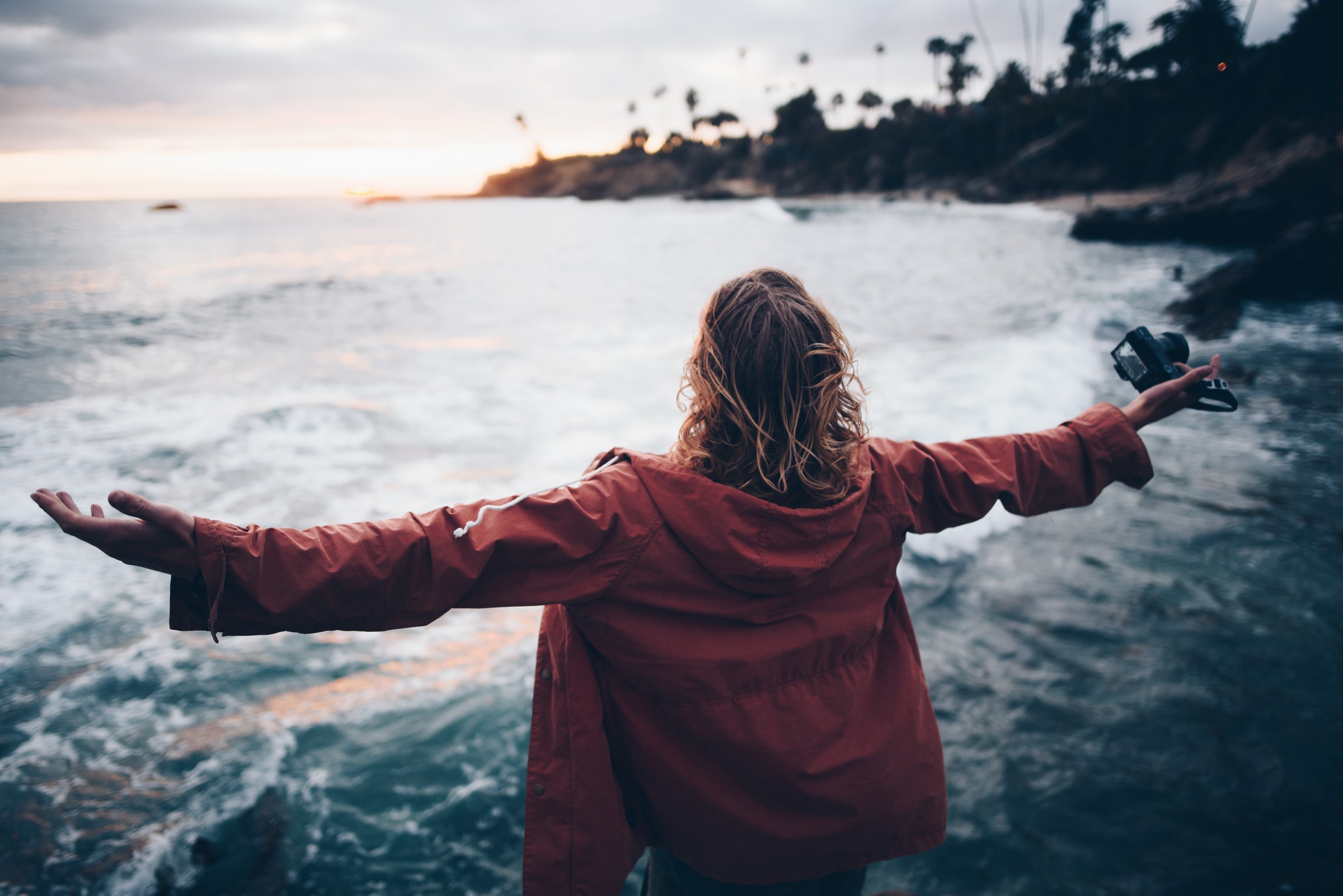 woman standing on beach in Laguna Beach, California