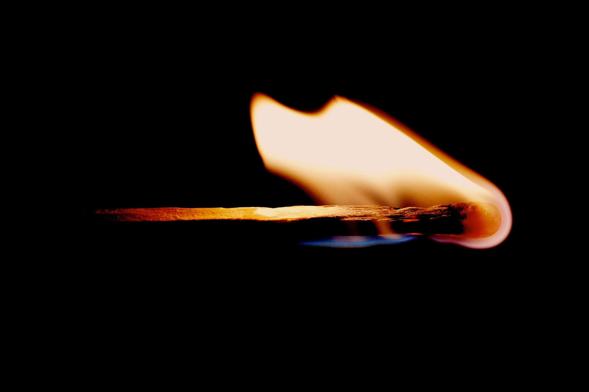 closeup of lit match with flame